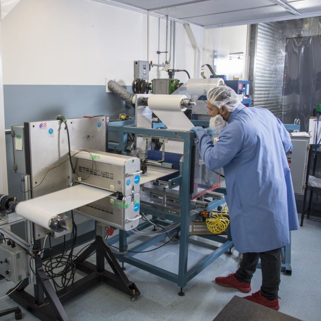 Film lamination and slitting